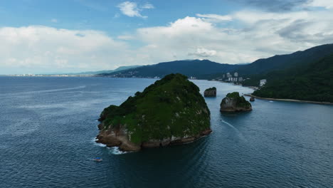 drone shot around the mismaloya arches, on the coast of puerto vallarta, mexico