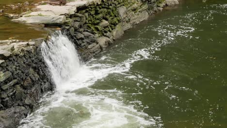 Waterfall-near-Covered-Bridge,-Thomas-Mill-at-the-Wissahickon-Creek