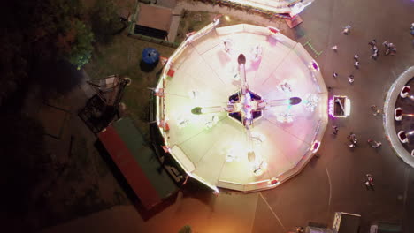 Aerial-view-of-twister-or-scrambler-ride-at-carnival