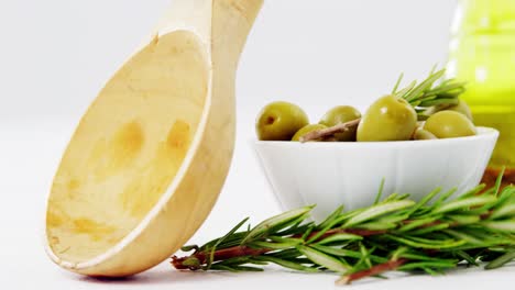 herbs, green olives and olive oil