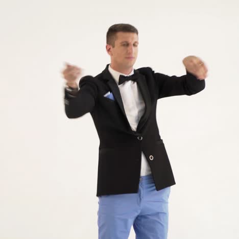 ?harismatic showman is mimicing and playing the drums in the similitude of a drummer at concert on a white background