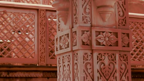 artistic-hand-carved-red-stone-jain-temple-at-morning-from-unique-angle-video-is-taken-at-Shri-Digamber-Jain-Gyanoday-Tirth-Kshetra,-Nareli-Jain-Mandir,-Ajmer,-Rajasthan,-India