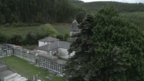 aerial reveal of old church in the countryside at galicia in spain