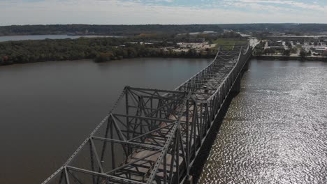 McClugage-Bridge-connecting,-Peoria-and-East-Peoria-on-Route-150,-Aerial-view-spins-to-view-of-downtown-Peoria,-Illinois