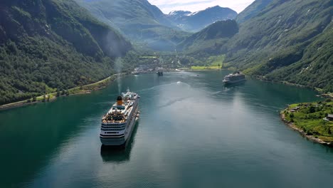 cruise liners on geiranger fjord, norway