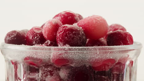 Frozen cranberries cooking for tea or jam, Background Close up of cranberry berries in on the kitchen, chef making dessert healthy pie.