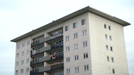 panning shot of isolated modern condominium in residential area