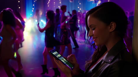 woman using mobile phone at a party