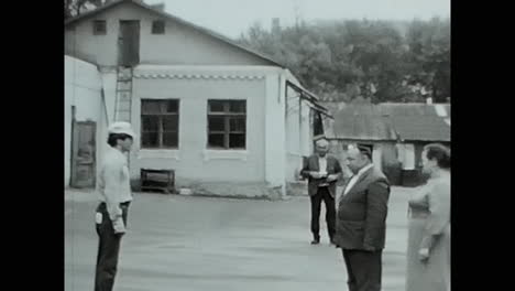 group of soviet people are preparing for a tourist trip. circa ussr 1970: group of soviet people are preparing for a tourist trip