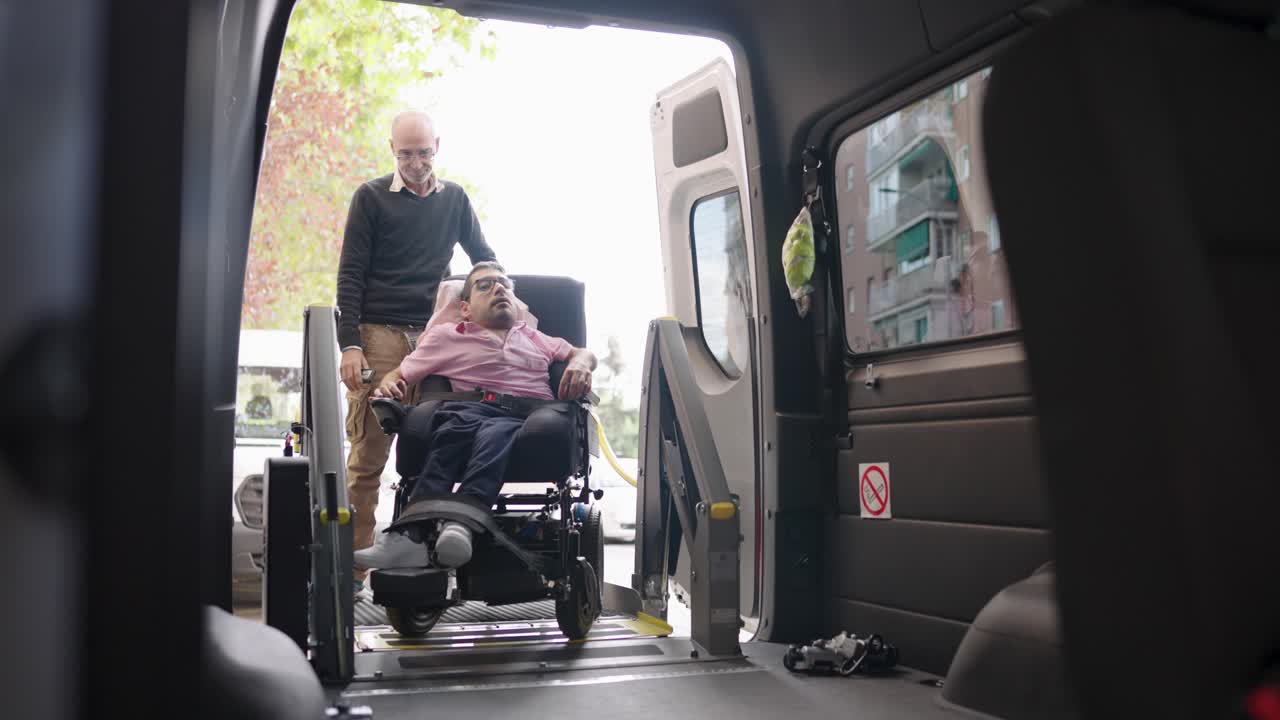 Assisting a person in a wheelchair into a van