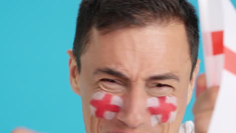 close up of a man supporting english team