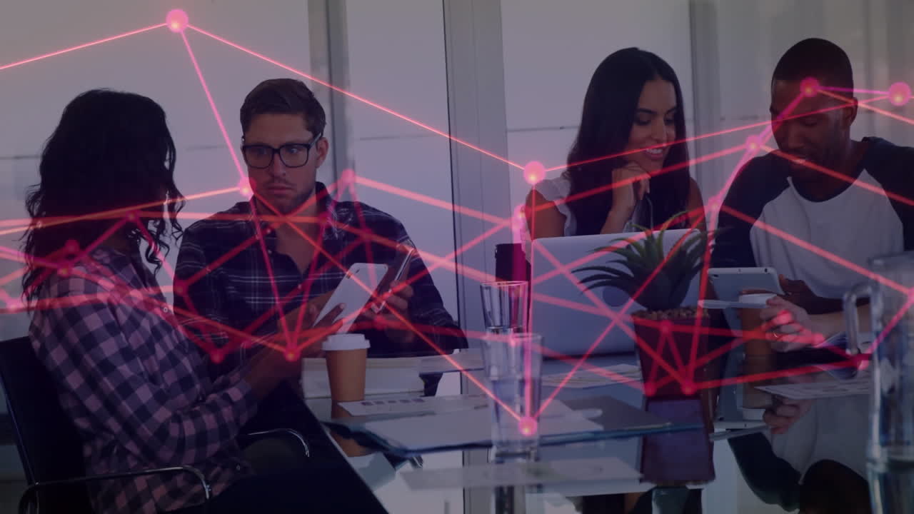 Diverse team collaborating at office with network connections animation overlay