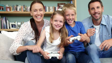 cute family playing to video games