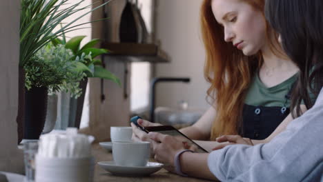 young business woman using tablet computer in cafe viewing corporate documents on screen browsing emails enjoying mobile touchscreen technology