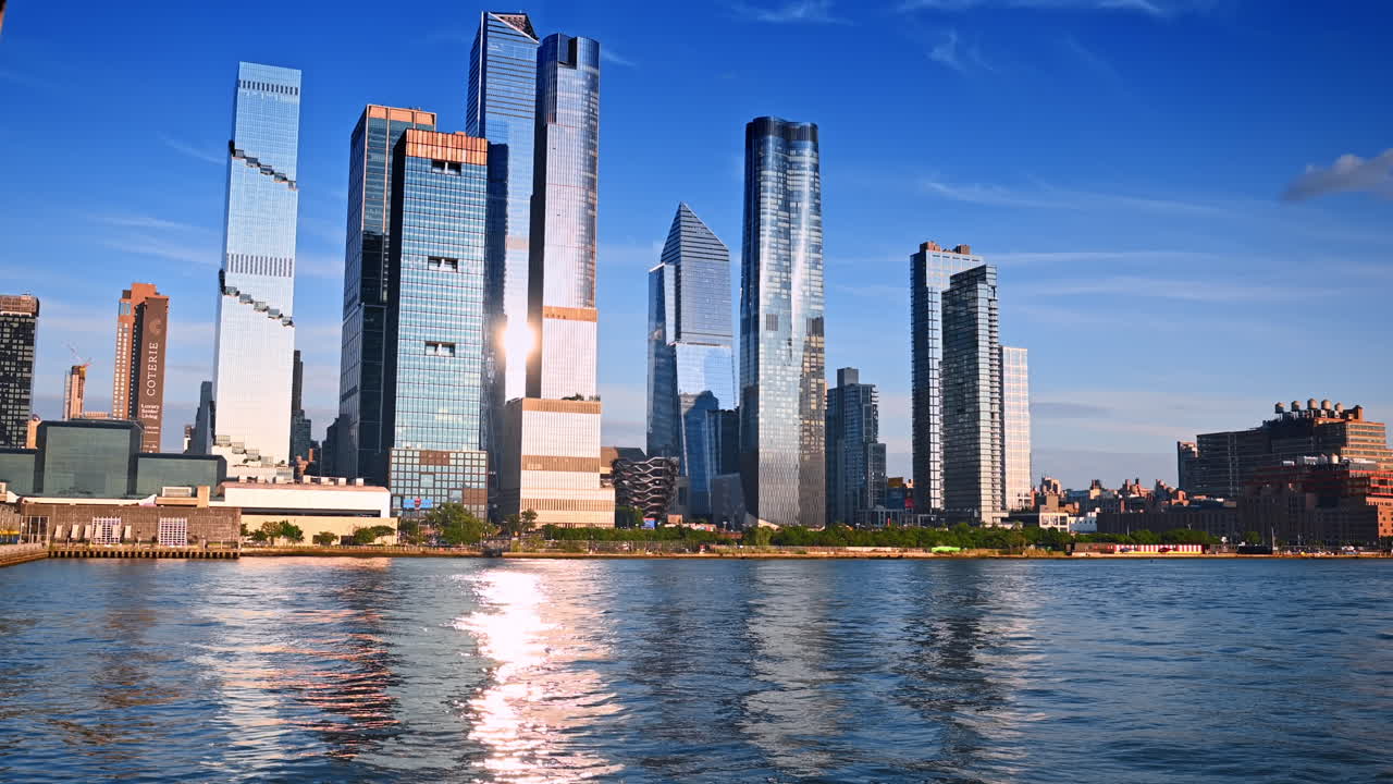 New York, USA, 15 April 2026: Hudson Yards skyscrapers reflected on Hudson River. Modern Hudson Yards skyscrapers reflecting on Hudson River water during sunny afternoon in Manhattan New York