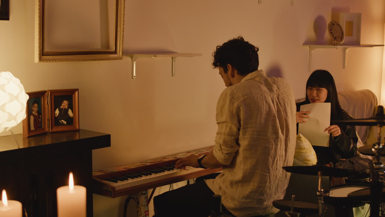 A group of people in a room playing music