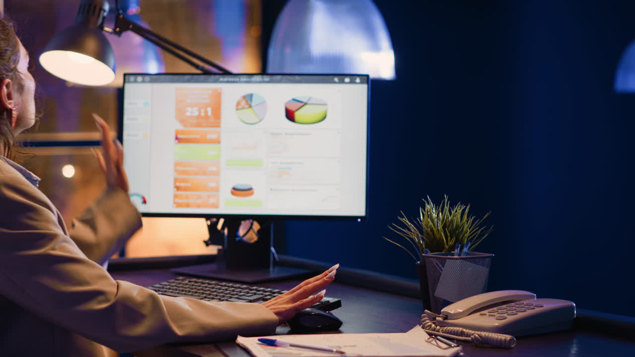 Businesswoman working late at the office with a computer
