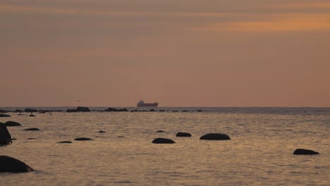 sunset in suurupi beach estonia during night and evening time with orange and yellow, red and yellow colors