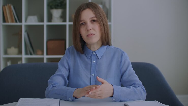 woman sit on sofa in living room look at laptop screen start conversation videocall app. E-employment pass job interview remotely business solutions via videoconference due corona virus quarantine