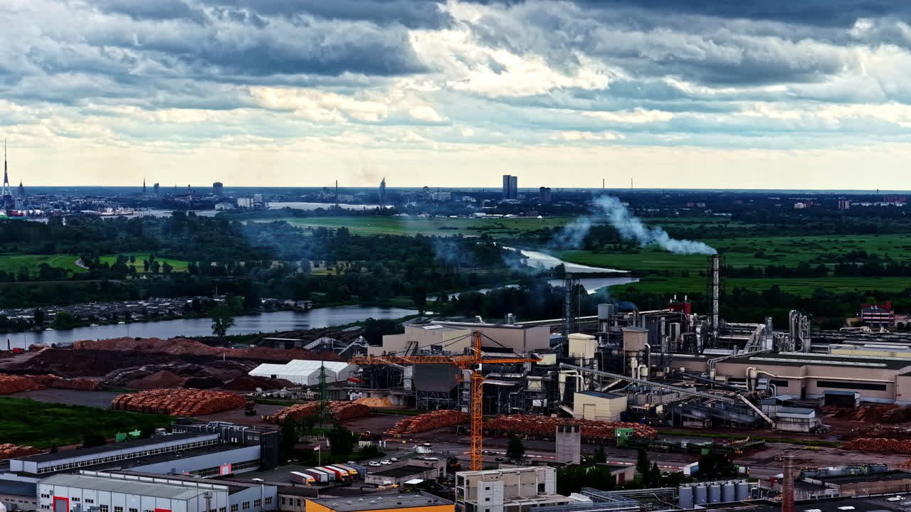 Industrial area smokestack industry heavy manufacturing factory buildings chimney smoke steam