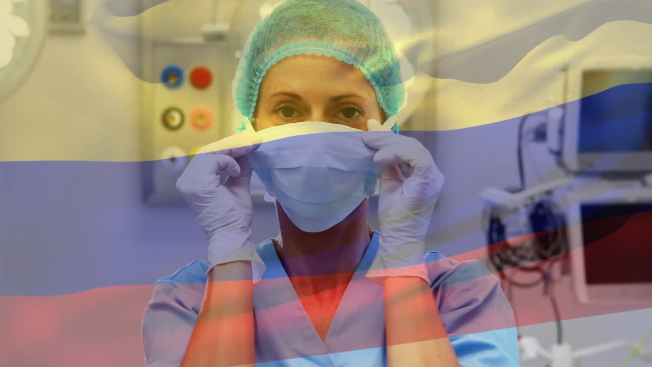 animación de la bandera de colombia ondeando sobre el anestesiólogo en el quirófano