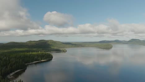 Sandy-beach-on-the-lake-with-green-trees