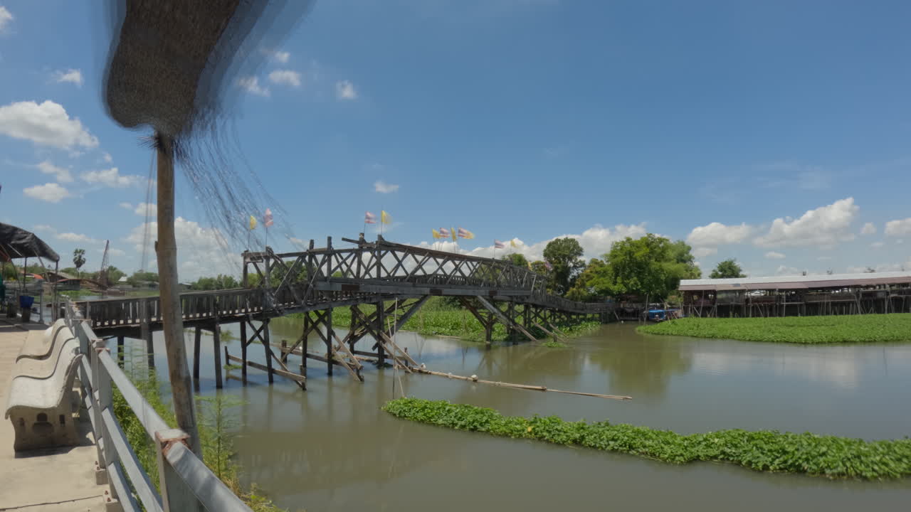 Wooden Bridge Over The River - Saphan Khong Floating Market. - timelapse