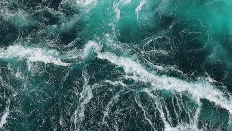 blue waves of water of the river and the sea meet each other during high tide and low tide.