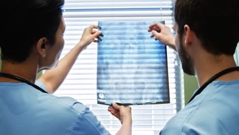 two doctor studying a x-ray