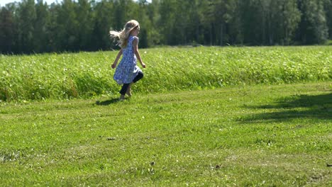 happy summer girl running in green grass landscape, freedom concept