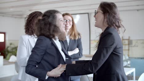 cheerful businesswomen celebrating success