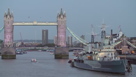 hms belfast and tower bridge at night