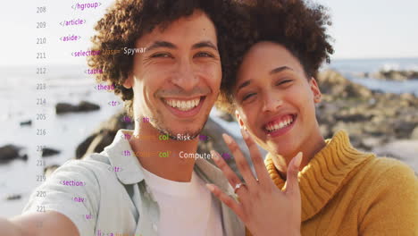 animation of data processing over african american couple embracing on beach