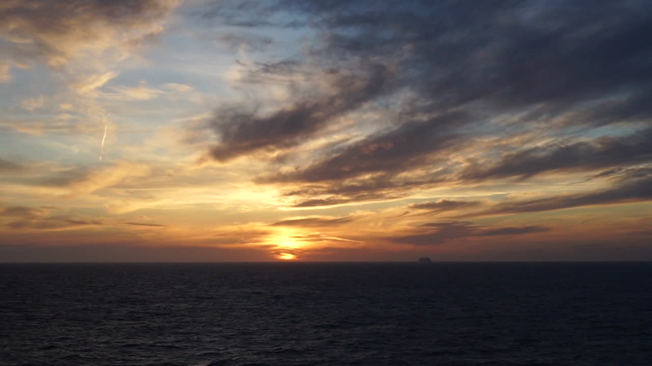 Ship cruising on sunset in the mediterranean sea