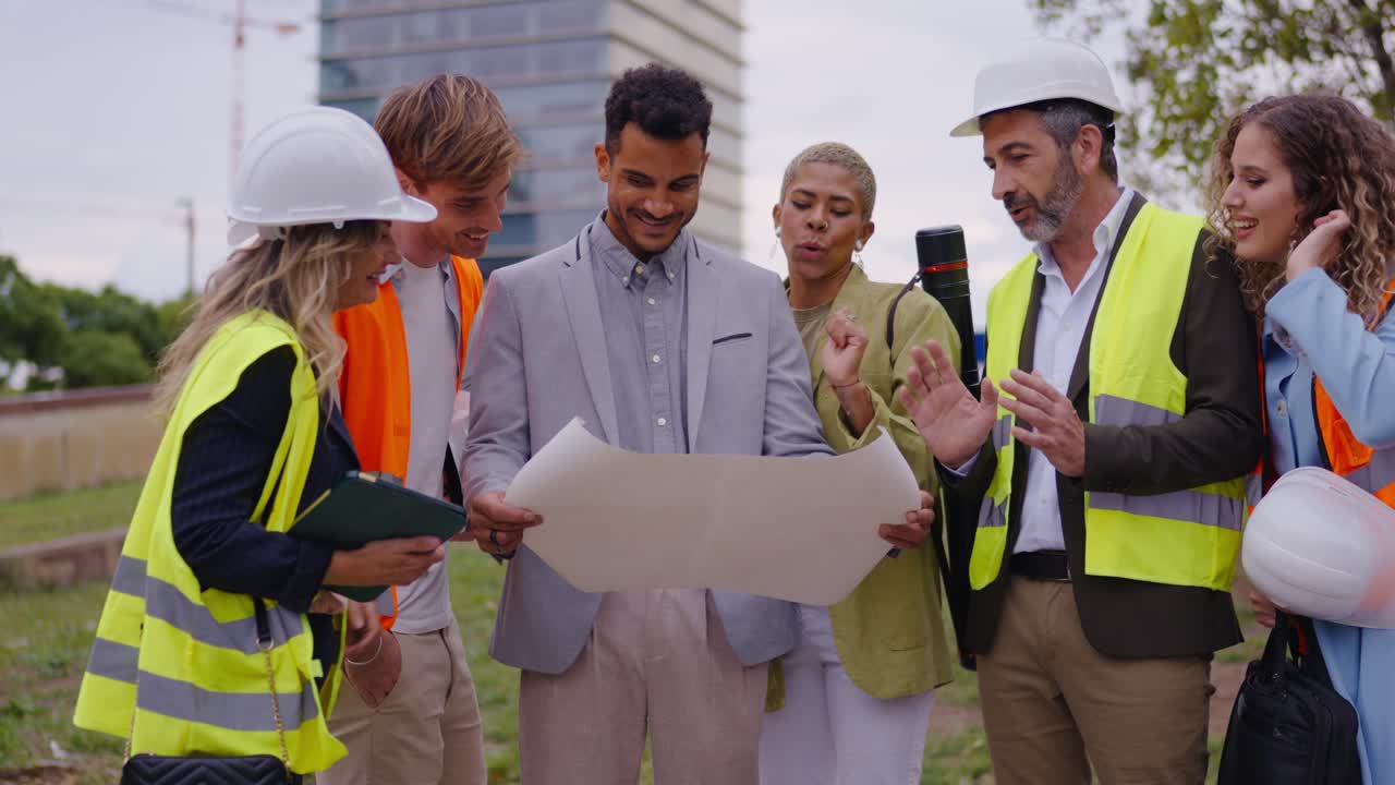 Construction Team Reviewing Blueprint at Construction Site