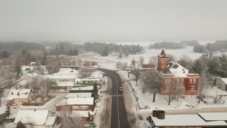 aerial, empty small suburban town in the united states during winter