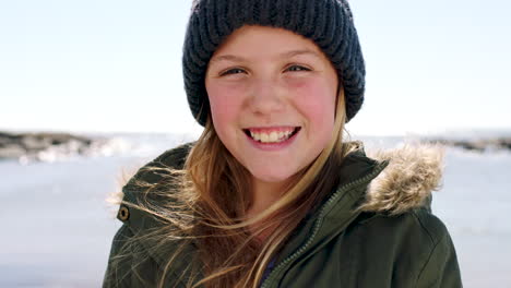 Child,-smile-and-beach-portrait-in-winter