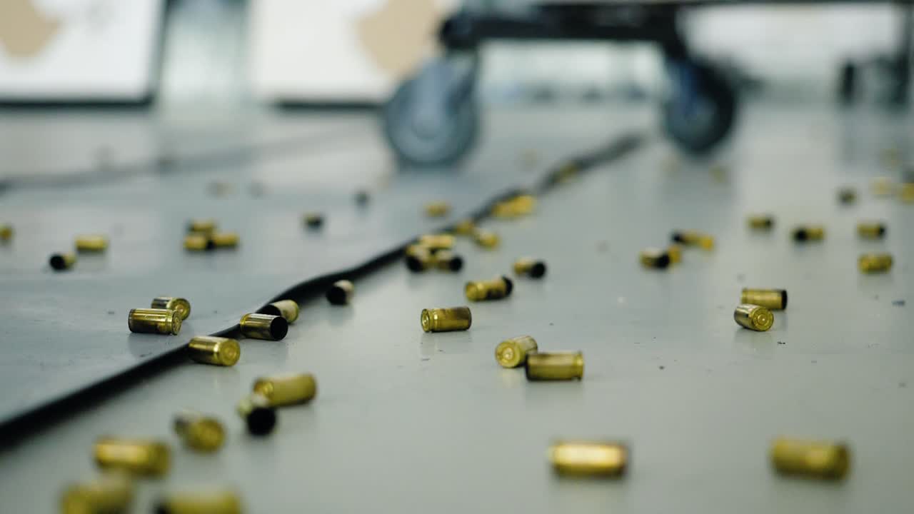 Scattered Empty Gun Cartridges on Shooting Range Floor