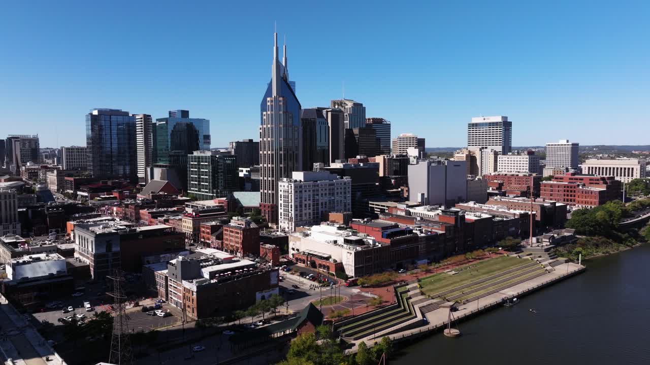 Drone Descends to Reveal Pedestrian Bridge along Cumberland River. Nashville