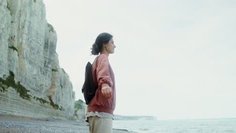 woman hiking on the beach