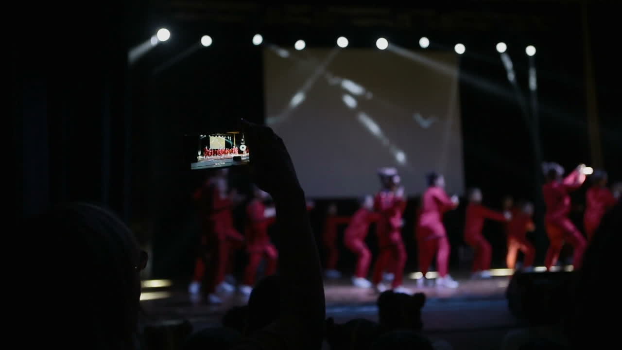 Hip-hop Dancers on Street Stage. VINNITSA, UKRAINE - MAY 2017: Group of young hip-hop dancers on street stage at night