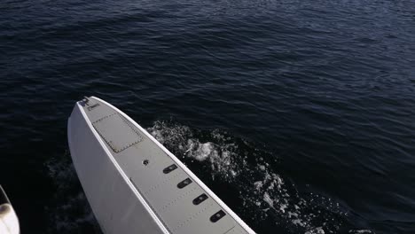 Close-Up-Seaplane-Float-Moving-on-Shimmering-Water