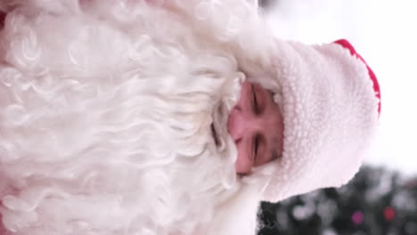 Closeup of a Traditional Santa Claus Looking at the Camera and Smiling Happy Santa Claus in Looking at the Camera Closeup of a Traditional Santa Claus Looking at the Camera and Smiling