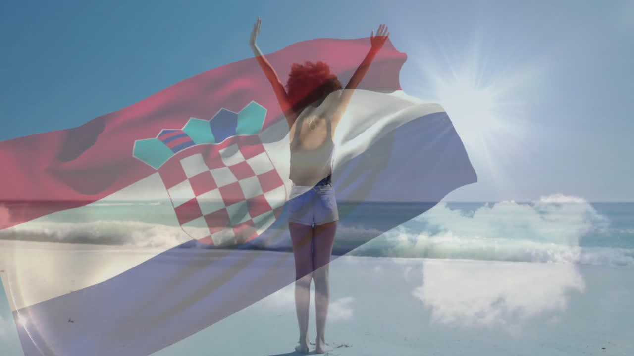 On beach, person raising arms over Croatian flag in bright sunlight animation
