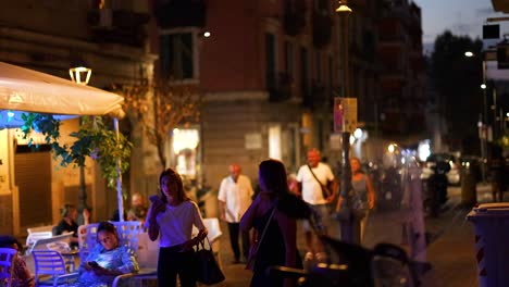 people walking and dining on a street