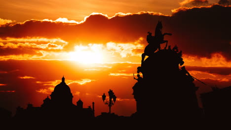 sunset silhouette of monument over city