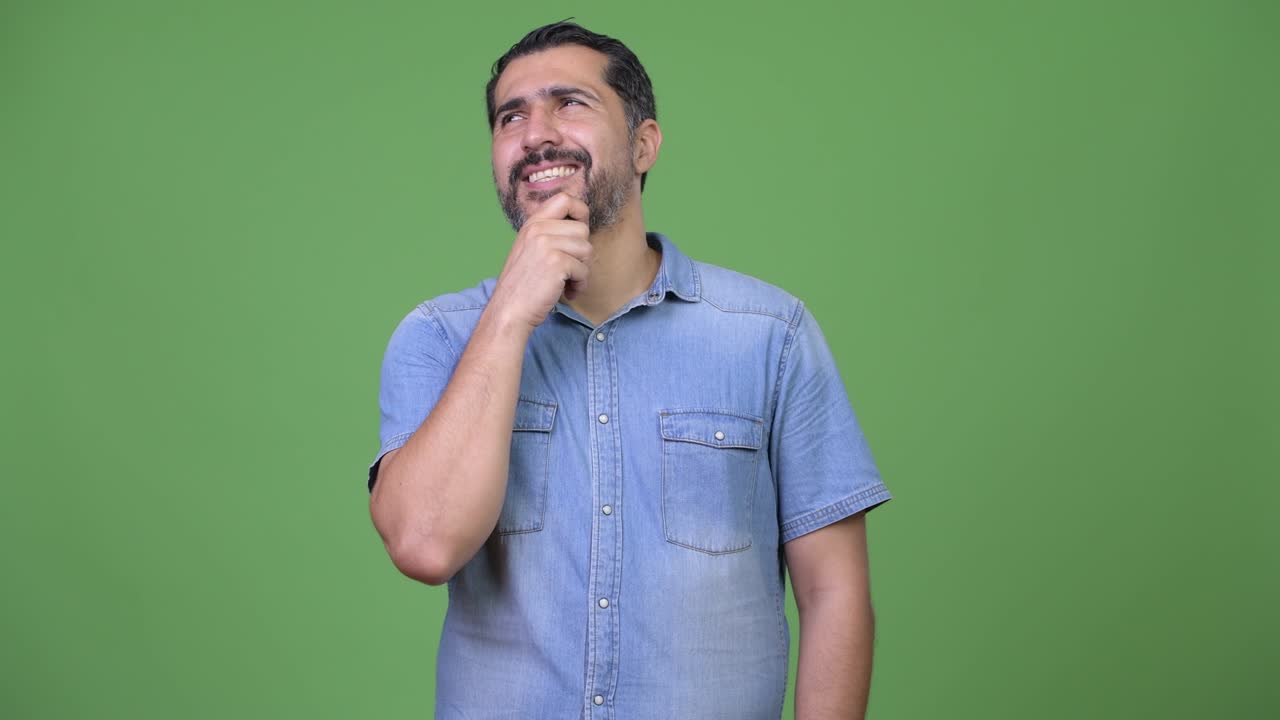 Handsome Persian bearded man thinking