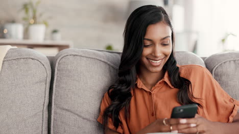 Woman,-phone-and-smile-for-chatting-on-living-room