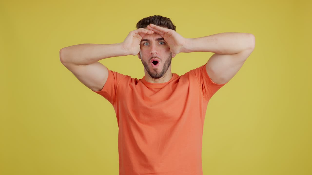 Man with funny, surprised expression looking intently