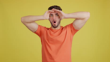 man with funny, surprised expression looking intently